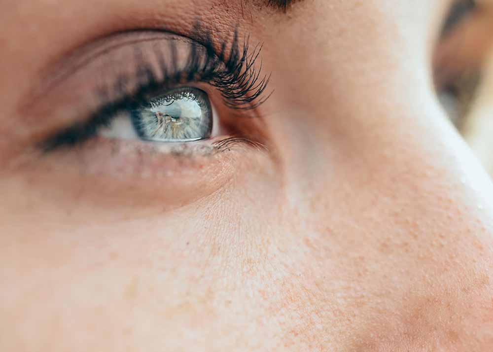 Make-up beautiful young woman's blue eyes Hyperopia (Farsightedness)